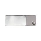 A small, rectangular, metallic tin with a sliding lid partially open, revealing the edge of a white object inside. The tin has a shiny, reflective surface and a simple, modern design.