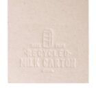 Close-up of textured paper with embossed text and a carton image, reading Made from recycled milk carton, China.