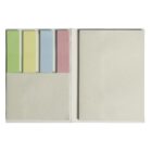 An open notebook with a beige cover. On the left page, there are four sticky note pads in green, yellow, blue, and pink. The right page is blank.