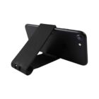 A black smartphone is placed on a horizontal stand, which is also black. The stand supports the phone in landscape mode, displaying the back camera and a portion of the phones rear. The setup is on a plain white background.