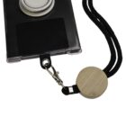 A smartphone case with a circular stand is attached to a black woven lanyard with a wooden accent and metal clip. The setup is designed for hands-free carrying.