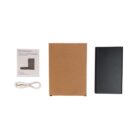 A power bank package includes a black power bank, a USB charging cable, a cardboard box, and an instruction manual. The items are neatly arranged on a plain white background.