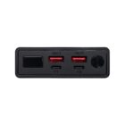 Close-up of a black power bank featuring two USB ports labeled OUT1 and OUT2, a USB-C port labeled C1, and a micro USB port labeled C2. There is also a circular button on the right.