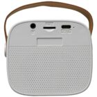 A white portable speaker with a perforated front, featuring connection ports on the top, including USB and headphone jacks. It has a brown carrying strap attached to the sides.