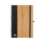 A spiral-bound notebook with a bamboo cover and a black fabric spine. It has an elastic band for closure. A small RPET logo with a recycling symbol is printed on the front.