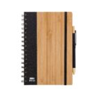 A bamboo-covered spiral notebook with a textured black spine and an elastic band. A pen is secured on the right side with a loop. The cover features an eco-friendly recycling symbol and RPET text.