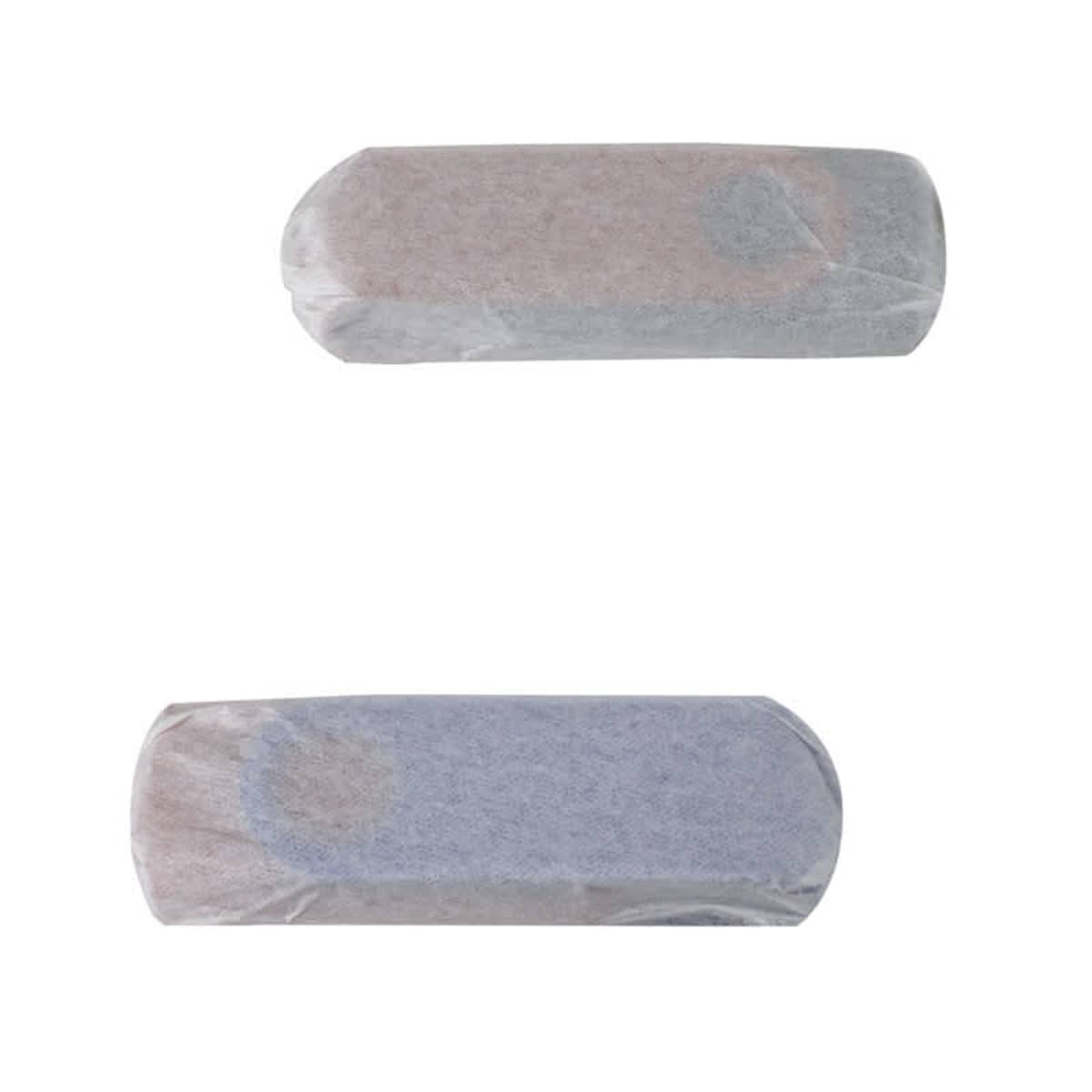 Two rectangular bars wrapped in translucent paper. The top one appears white, while the bottom one looks slightly blue-gray. The wrappers allow a glimpse of the bars’ texture beneath.