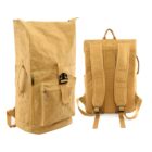 Two views of a light brown backpack: the front view shows a zippered pocket and a buckle closure, while the back view displays padded shoulder straps and a top handle. The bag has a tall, cylindrical shape with a textured fabric.