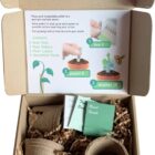 Seed starter kit with peat pots, pellets, plant labels, seed packs, and instructions in a box.