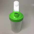 A transparent plastic shaker bottle with a green lid is pictured. The lid has a white flip-top cap that is open, revealing the bottles spout. The bottle is placed against a plain gray background.