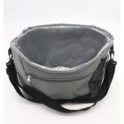 A gray insulated cooler bag with a black adjustable shoulder strap. The bag is open, revealing a silver lined interior, and has a front zipper pocket. The background is plain white.