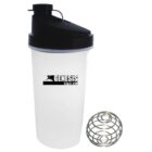 A clear plastic shaker bottle with a black lid, branded with Genesis Fitness Club logo. Beside it is a metal wire whisk ball, used for mixing drinks, on a white background.