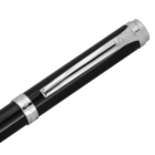 Close-up of a black fountain pen cap with a silver clip and silver accents. The pen has a sleek, glossy finish, and the clip features an engraved letter S. The cap ends with a silver top, adding to its elegant design.