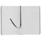 An open notebook with lined pages and a black ribbon bookmark positioned in the center spread. The notebook has a black cover and is laid flat, showing both pages.