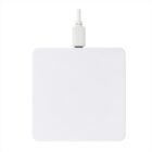 A white square wireless charging pad with a connected cable at the top. The pad has a minimalist design on a white background.