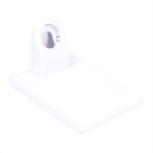 A white plastic holder with a slanted base and an oval opening at the top. The design is minimalistic and modern, suitable for holding small devices or accessories.