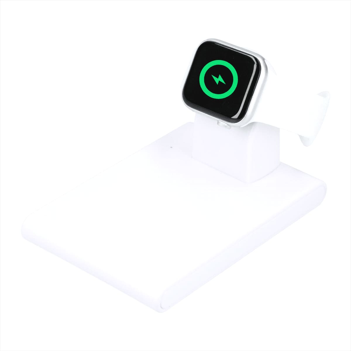 A smartwatch with a white band is placed on a white charging stand. The watch screen displays a green charging symbol. The charging stand is positioned against a plain white background.