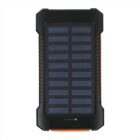 A black and orange solar power bank with a grid pattern of solar panels on the front. It has a rugged design, with a rubberized casing for durability.