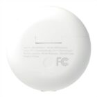 The image shows the back of a white round earbuds charging case with text including item number, PO number, input specifications, battery capacity, and Made in China, along with an FCC logo.