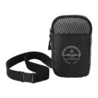 A small black crossbody bag with a grid pattern on the upper part and an adjustable strap. It features a circular logo with text: Live Outdoors Live Wild Live Free Est. 2012 and a mountain design.