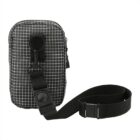 A small black crossbody bag with a white grid pattern and a long black adjustable strap. It features a front zipper pocket and a loop with a plastic clip on the front.