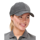 Person smiling in Sport Cap and gray polo shirt against a white background.