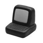 A black and gray rubber stress toy shaped like a retro computer, featuring a small screen and a keyboard on a compact base.
