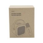 The image shows a brown cardboard box with line drawings of a karaoke machine and a microphone. The box is labeled T019 Caroline Portable Karaoke Machine.