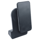 A black smartphone is placed on a sleek, black wireless charging stand with a modern design. The phones screen is facing forward, and the stands minimalist style is visible from a side angle.