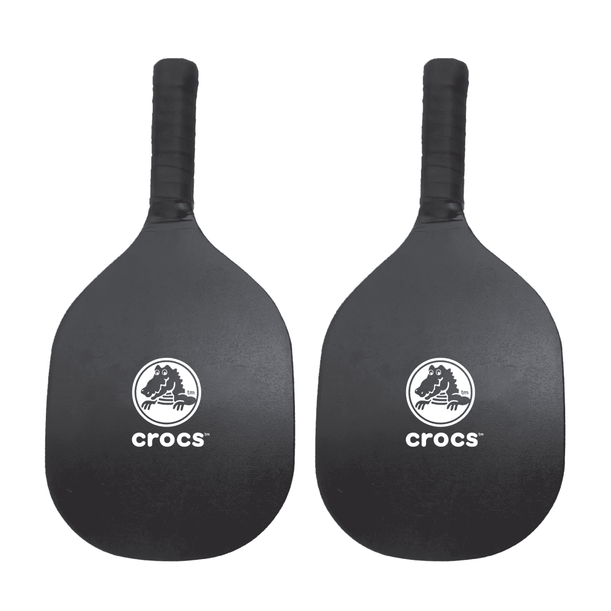 Two black pickleball paddles with the Crocs logo in white on the face. The handles are wrapped in black grips. The paddles are placed side by side against a white background.