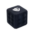 A black fidget cube with raised circular bumps on one side and a stylized white logo on another. The cube is designed for tactile interaction and stress relief.