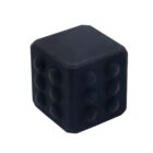 A black silicone cube featuring raised bumps on its sides, designed for gripping or massaging.