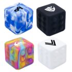 Four colorful, textured cubes, each with a unique design: a blue and white marbled cube with an A, a solid black cube with a logo, a multi-colored cube with Quiksilver, and a plain white cube with an arrow symbol.