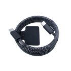 Coiled black and white braided USB-C cable with connectors at both ends, secured with a black strap in the center.