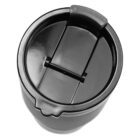 Close-up view of a black travel mug lid with a closed snap-on flap. The surface is glossy, with a secure seal, designed to prevent spills. The circular shape and simple design are visible from a top-down perspective.