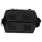 A black rectangular bag with textured rubber patches and a handle on one side. It has a zippered top opening and features sturdy construction, ideal for carrying or transporting items securely.