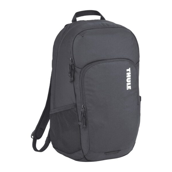 A black Thule backpack featuring a large main compartment, two zippered front pockets, and a mesh side pocket. The brand logo is printed vertically in white on the front. The backpack has adjustable padded shoulder straps and a top carrying handle.