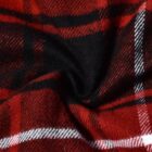 Close-up of a red and black plaid fabric with a swirling pattern. The pattern features bold black lines crossing over red, accented with white stripes, creating a classic tartan design. The fabric appears soft and textured.