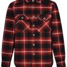A red and black plaid flannel shirt with long sleeves and a button-up front. It features two buttoned chest pockets and a rounded hem.