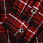 Close-up of a red and black plaid shirt sleeve with white accents. The fabric features two silver buttons on the cuff, highlighting a classic flannel pattern.