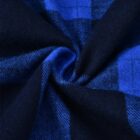 A close-up of a twisted fabric showcasing a classic plaid pattern in navy blue and bright blue. The texture appears soft and slightly fuzzy, with intersecting lines creating a grid-like design.
