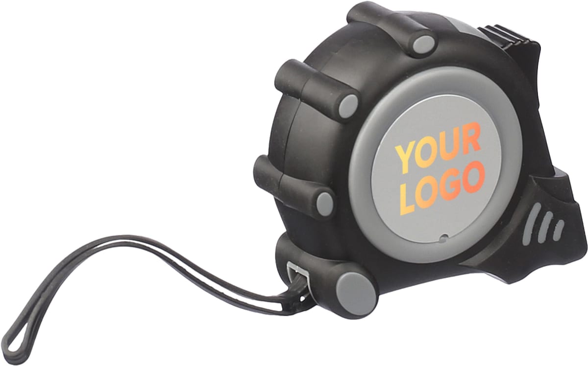 The Ramos MeasureMate tape, in black and gray, offers a YOUR LOGO area with vibrant orange and yellow text for customization. Its compact, ergonomic design and included strap ensure easy carrying and convenience.