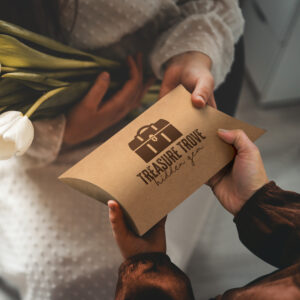 Hands exchanging a promotional gift box
