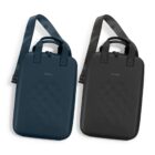 Two hard-shell shoulder bags, one navy blue and one black, with adjustable straps.