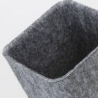 Rectangular gray felt bin with soft, textured sides on a light background.