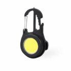 Black carabiner with a round yellow LED light on a white background.