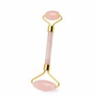 Pink jade facial roller with gold accents for skincare routines, isolated on white background.