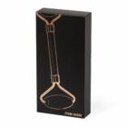Black box with a gold outline of a facial roller and the text ITEM 20558 at the bottom.