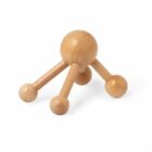 A wooden handheld massager with four rounded legs and a central round handle.