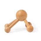A wooden handheld massager with three legs and rounded ends, on a white background.